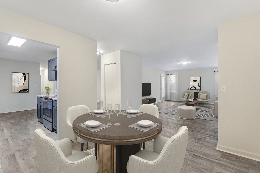 a dining room and living room with a table and chairs