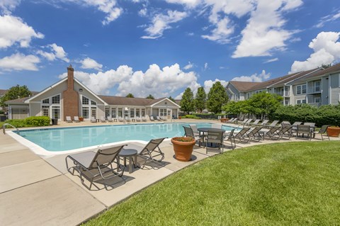 Pool With Lounge Chairs at The Apartments at Wellington Trace, Frederick, MD, 21703