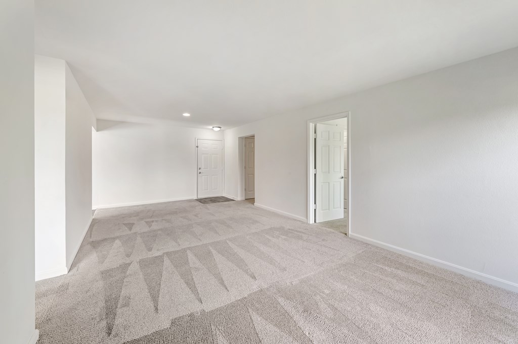 a bedroom with two beds and a window