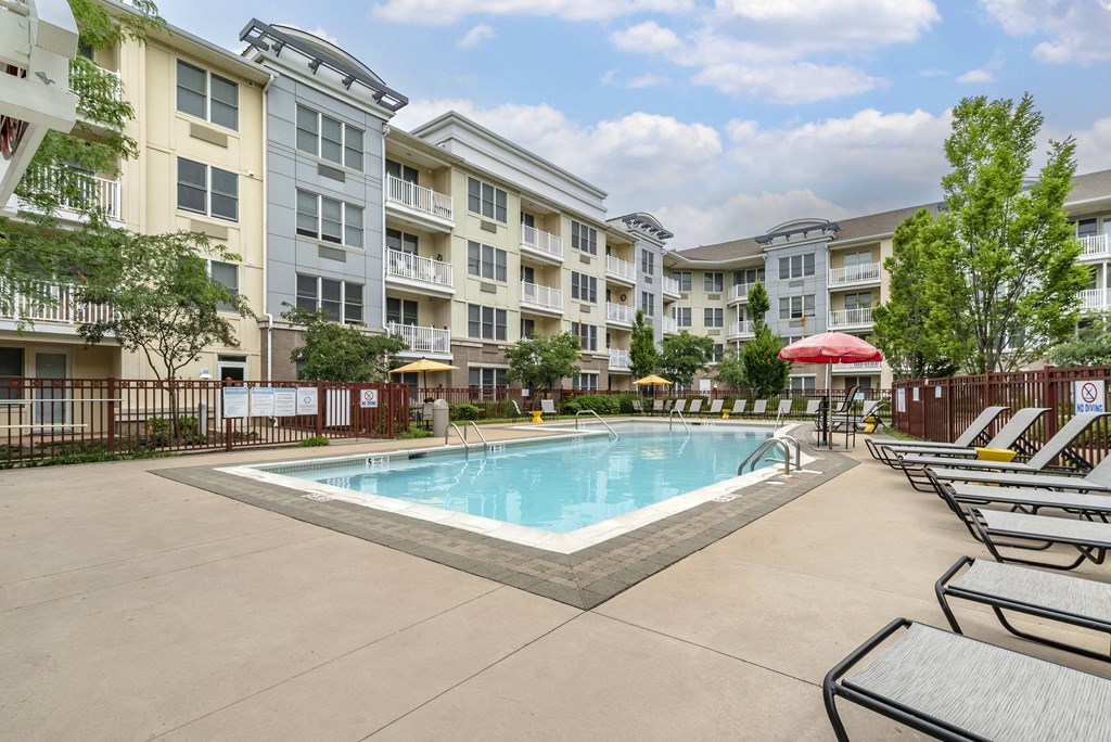 our apartments have a pool and lounge chairs in front of our building