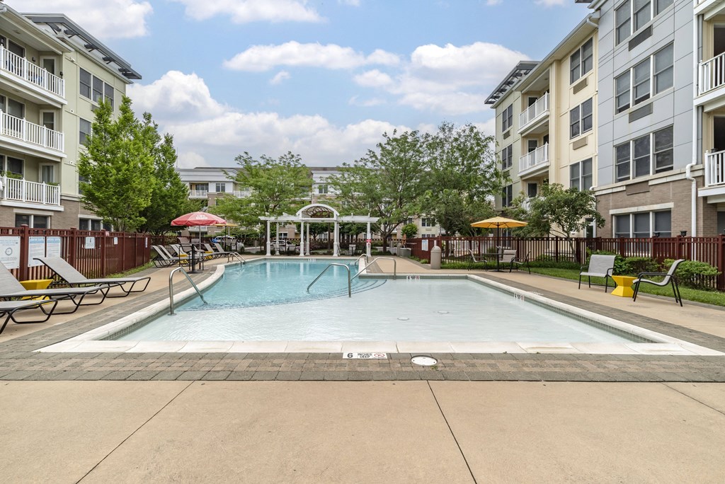 our apartments feature a swimming pool and a patio with umbrellas at Pier Village Apartments, Long Branch, New Jersey