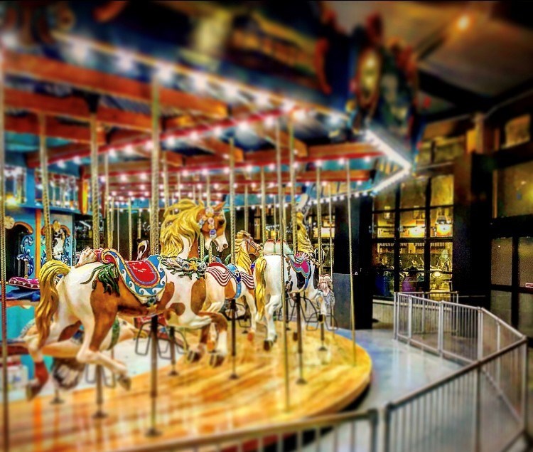 A carousel with horses as the main attraction.