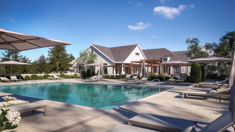 A large house with a pool in front.