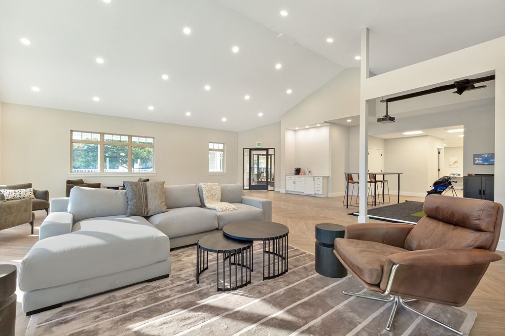 a living room with couches and a table at Copper and Quarry Village, Pikesville, MD