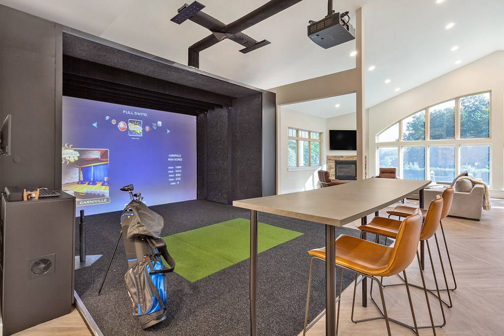 a conference room with a table and chairs and a projector screen at Copper and Quarry Village, Pikesville, 21209