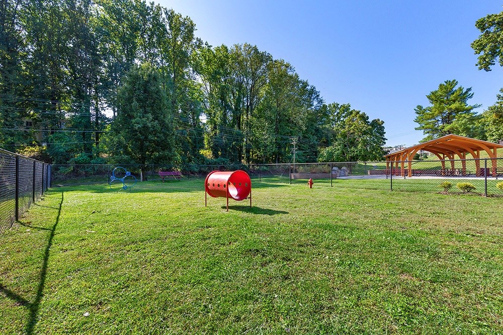 a park with a playground and a swing set at Copper and Quarry Village, Maryland, 21209