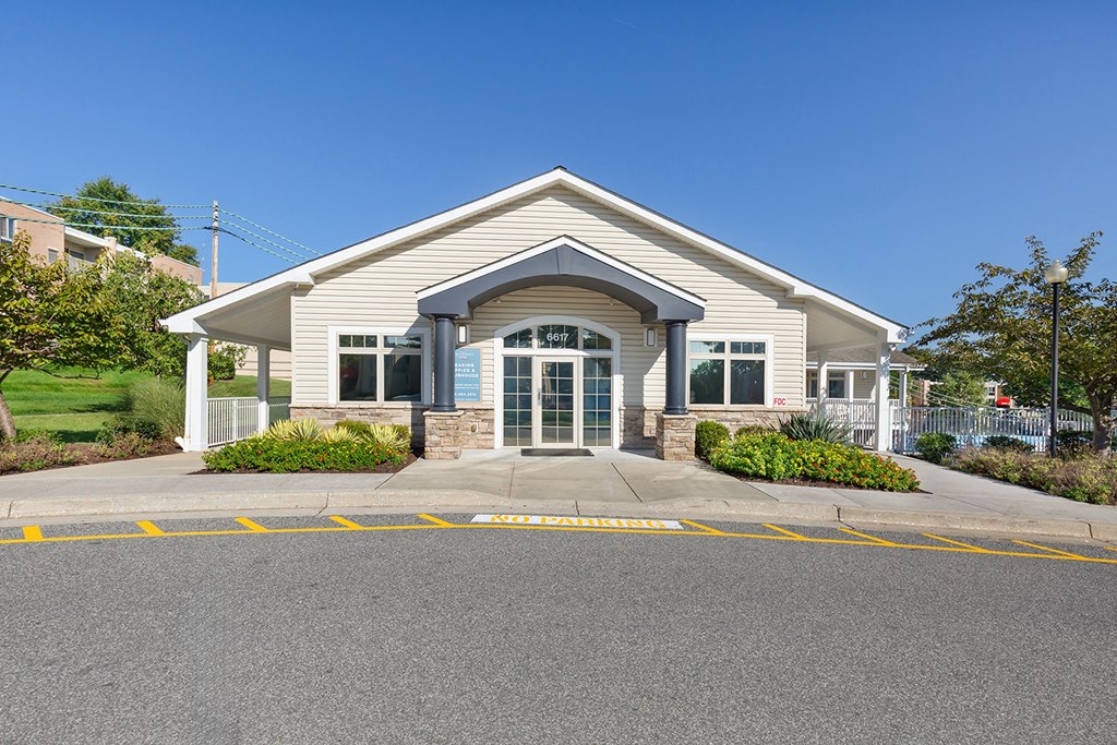the front of a house with a street in front of it at Copper and Quarry Village, Pikesville, 21209