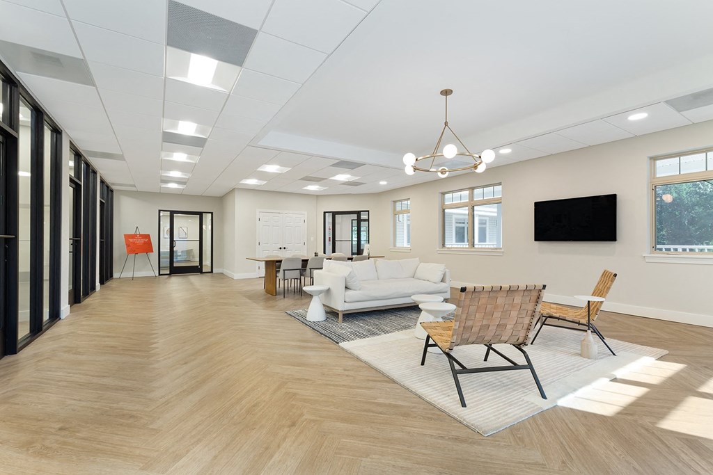 a rendering of a living room with a couch and chairs at Copper and Quarry Village, Pikesville, MD