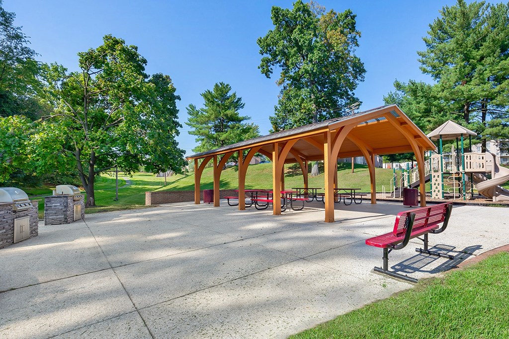 a park with benches and a picnic shelter at Copper and Quarry Village, Maryland