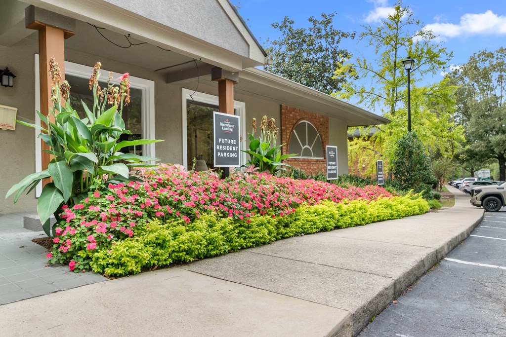 A building with a sign that says "Future Parking" in front of it.
