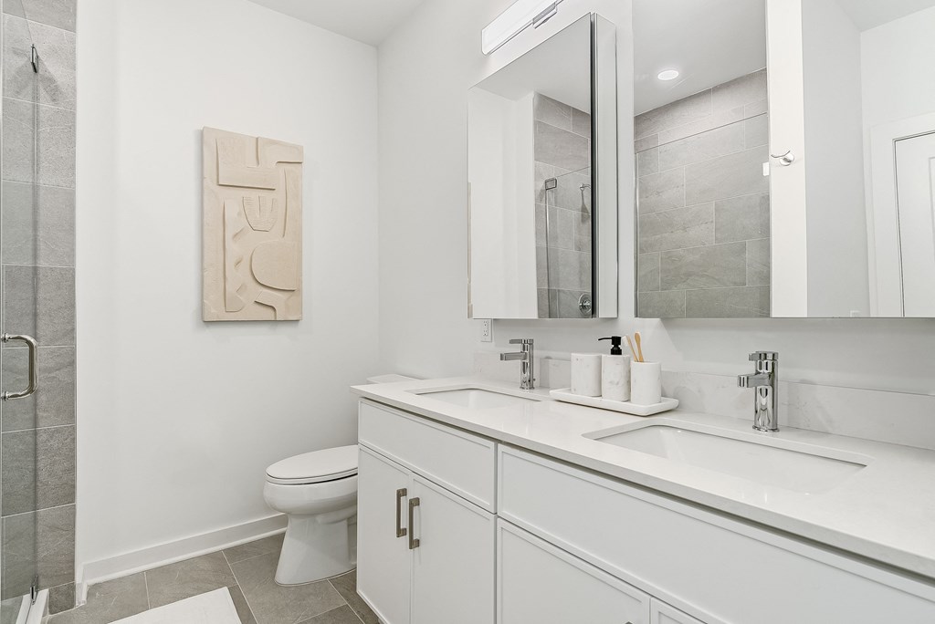a bathroom with a sink and a toilet and a mirror