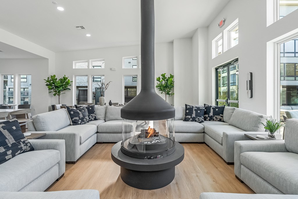 a living room with couches and a fireplace