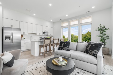 A modern kitchen with a dining table and chairs.