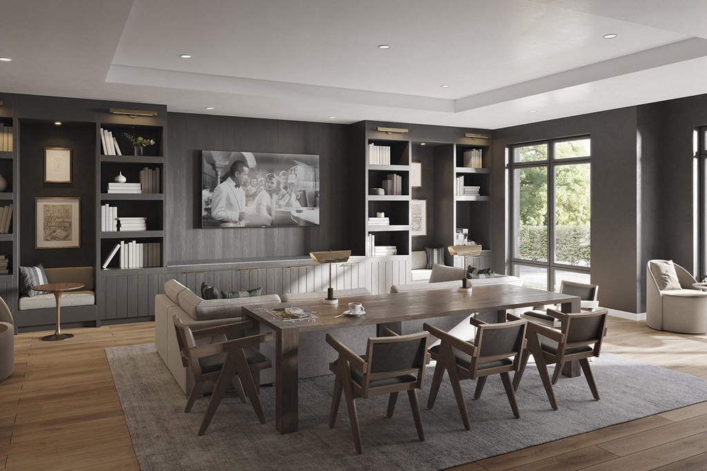 a large living room with a large table and chairs