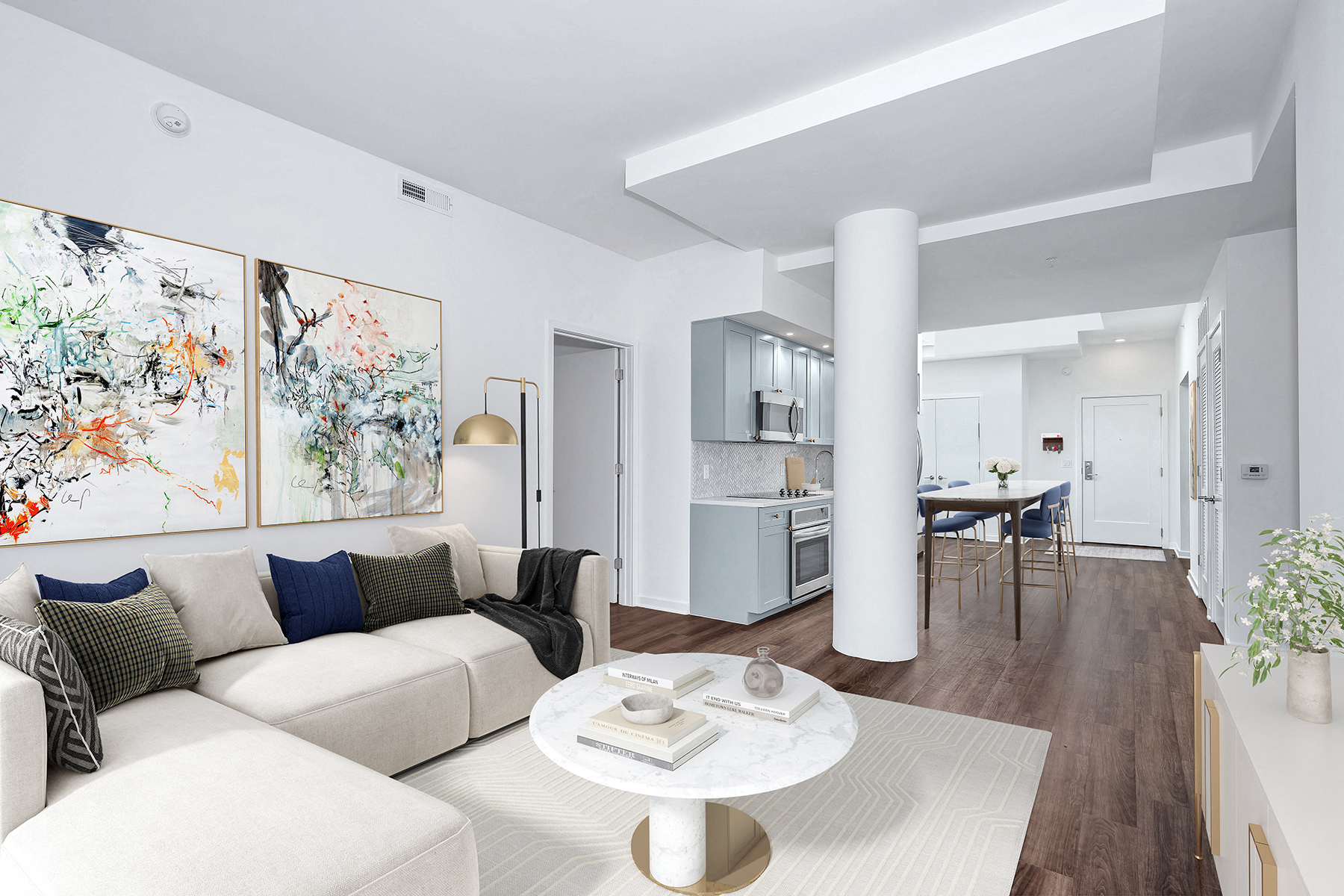 A modern living room with a white couch and a coffee table.