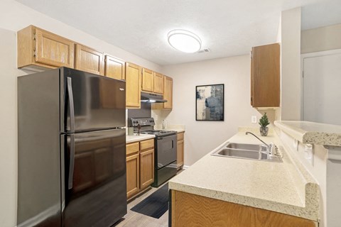 a kitchen with stainless steel appliances and granite counter tops