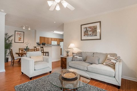 a living room with a couch and a glass table
