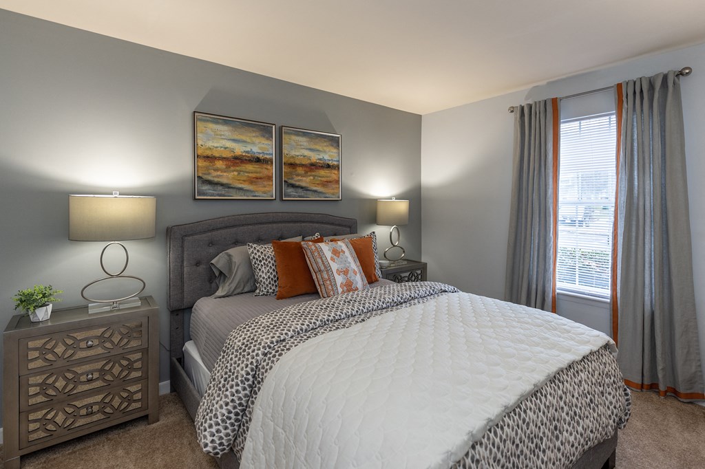 an overview of a bedroom with a bed and a window