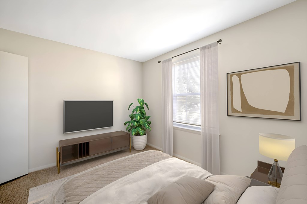 A modern bedroom with a large bed, a television, and a potted plant.