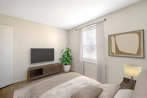 Bedroom with wall mounted tv and modern media console at The at Hunters Glen Apartments, Frederick, 21702