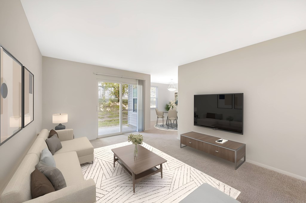 A modern living room with a flat screen TV mounted on the wall.