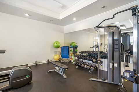 A well-equipped gym with various exercise machines and equipment.