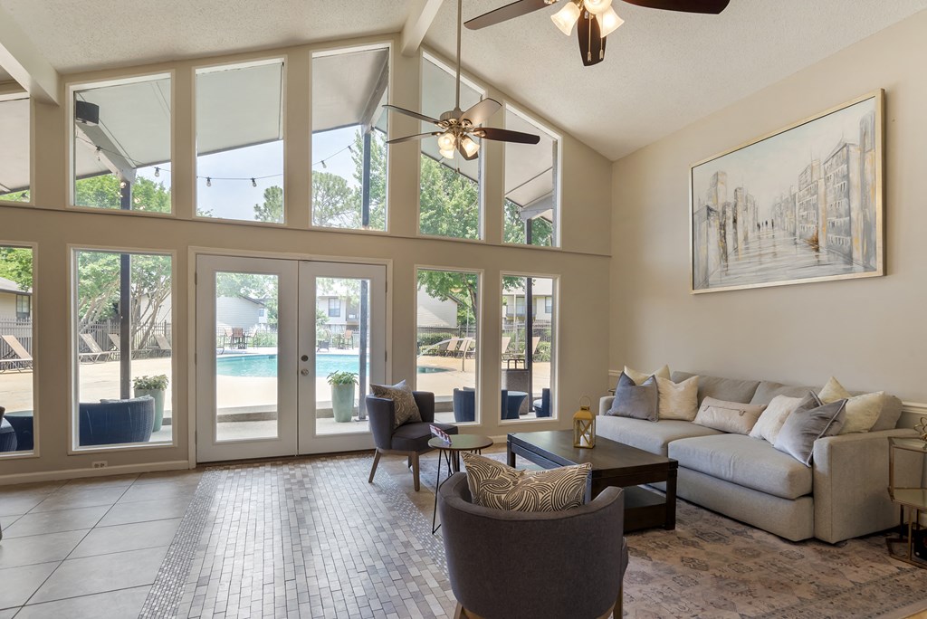 Clubhouse with grey sofa at Lakeshore Landing Apartments, Ridgeland, 39157