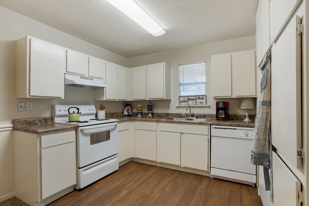 Kitchen with white cabinets at Lakeshore Landing Apartments, Mississippi