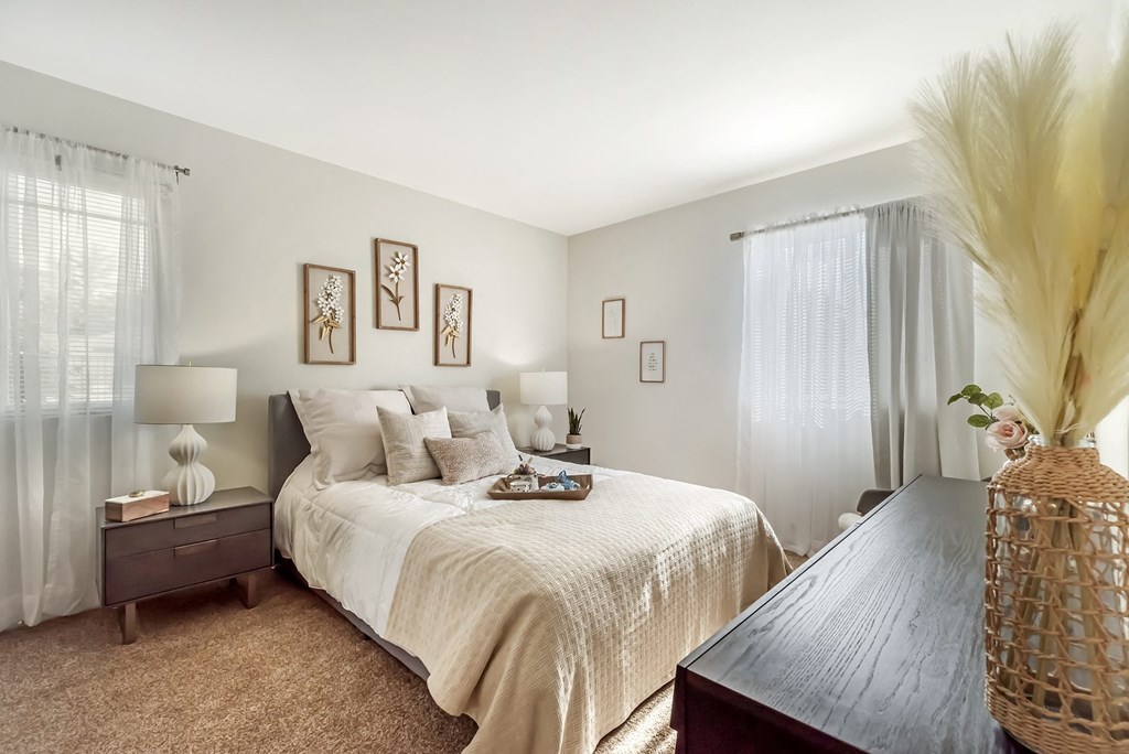 a bedroom with a large bed and a wooden table at Quail Ridge, New Jersey