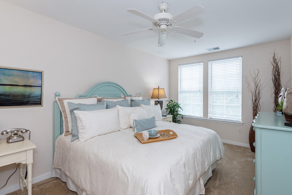 Bedroom with cozy bed Bedroom with cozy bed at River House Apartments, Norfolk, Virginia