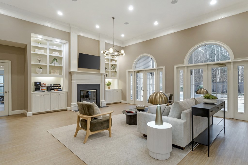 A modern living room with a fireplace and a television.