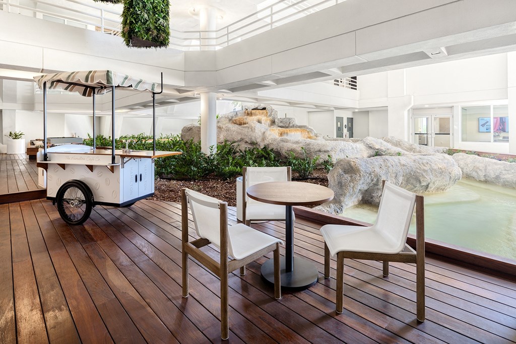 A room with a wooden floor and a hot tub.