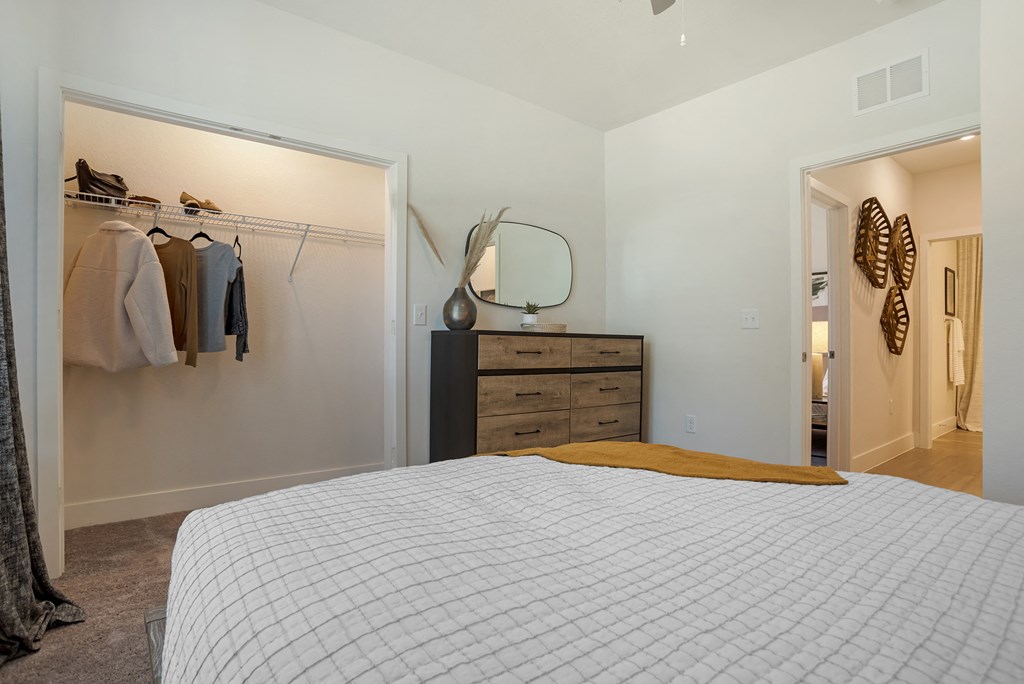 Bedroom with lamps and bed at The Mason at Fremaux Park, Louisiana
