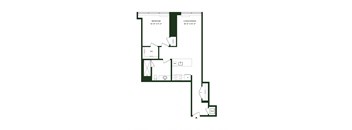 A floor plan of a room with a bedroom, living/dining area, WC, and a W/D.
