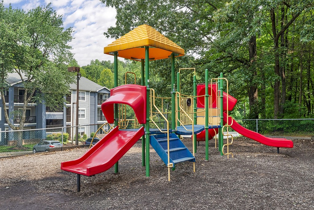a playground with slides and a swing set