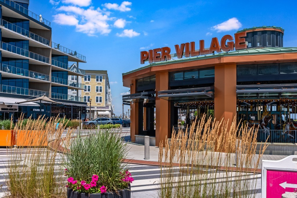 A building with the words "Pier Village" on it.
