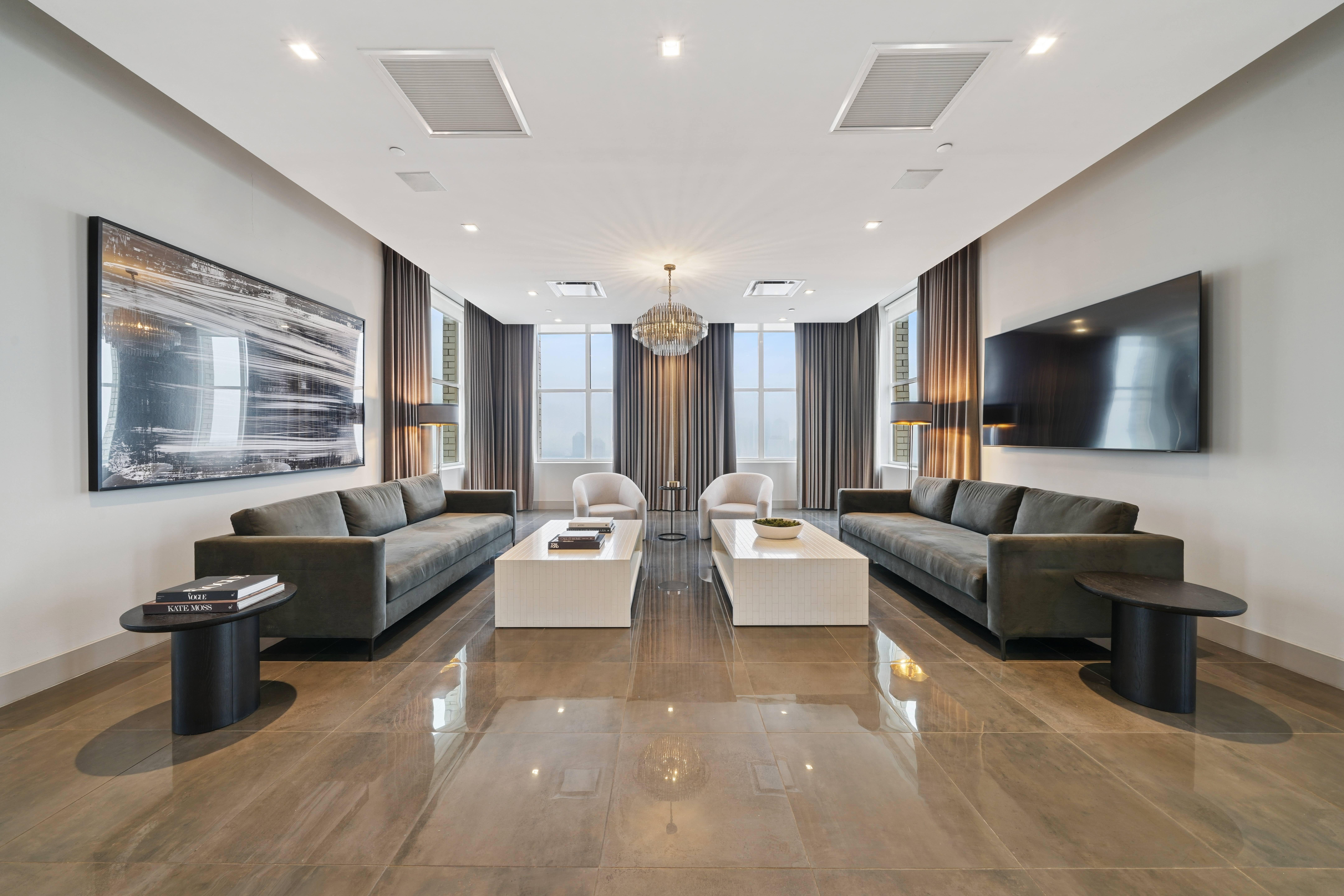 A modern living room with two sofas and a coffee table.