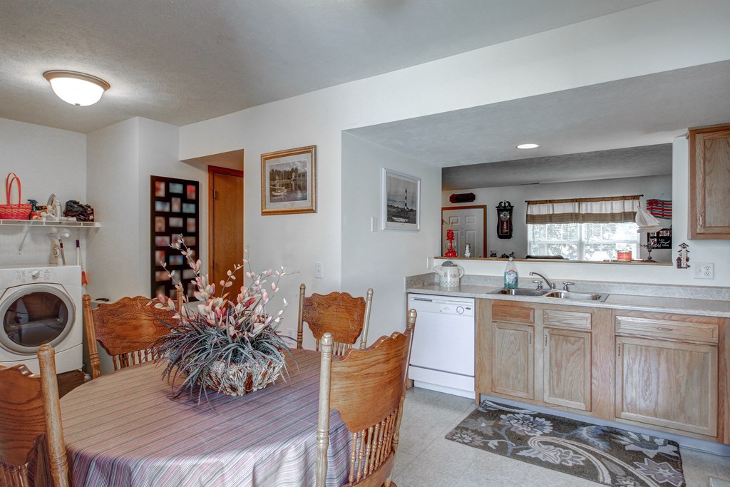 a kitchen and dining room with a table and chairs