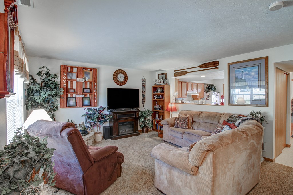 a living room with two couches and a tv