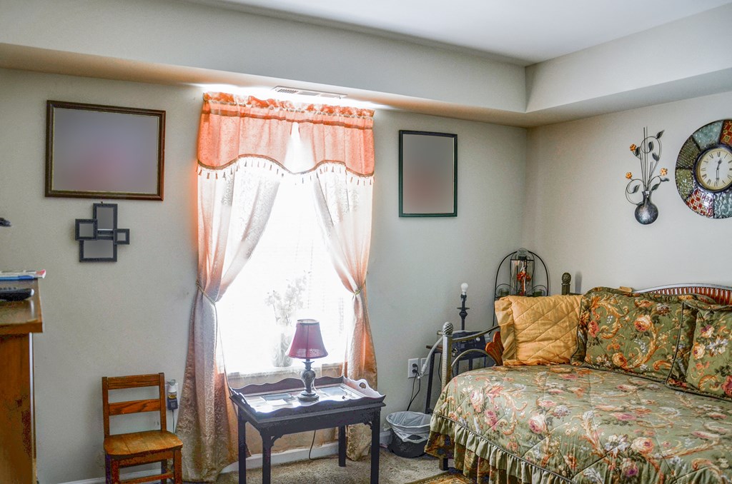 a living room with a couch and a window