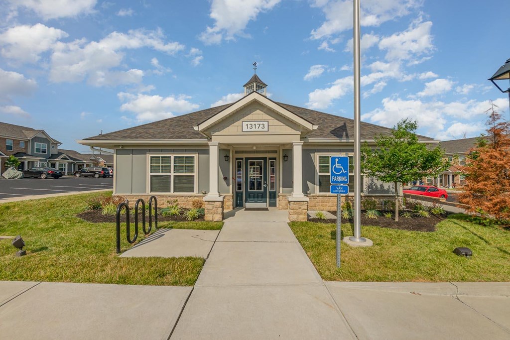 a building with a handicap sign in front of it