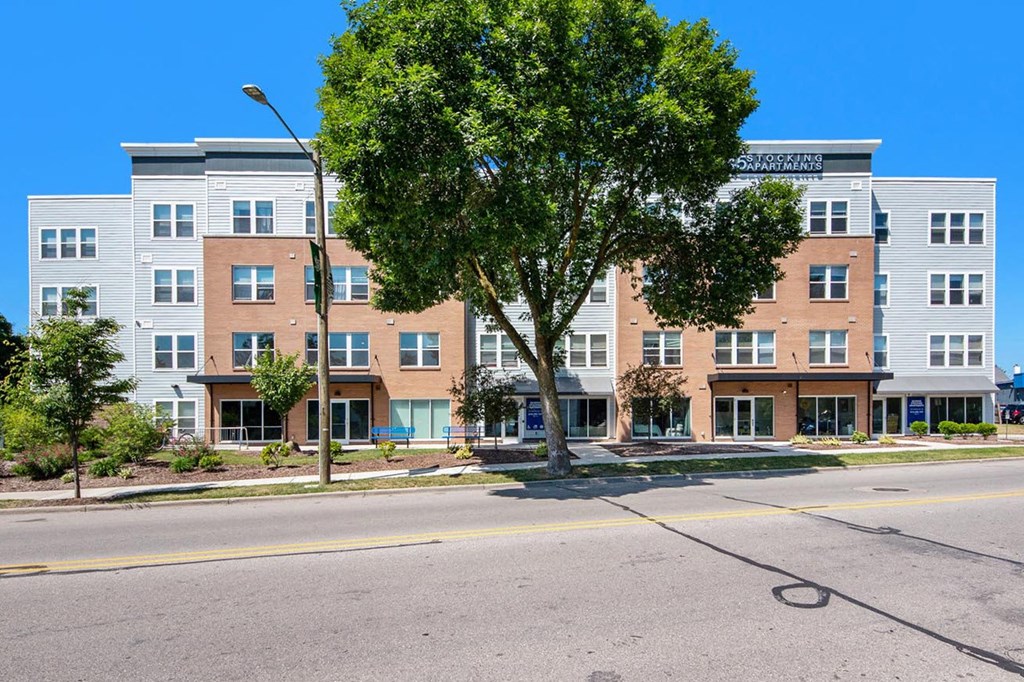 our apartments are located on the corner of a city street