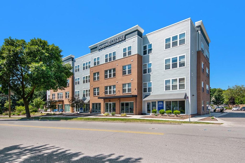 an apartment building on the corner of a street
