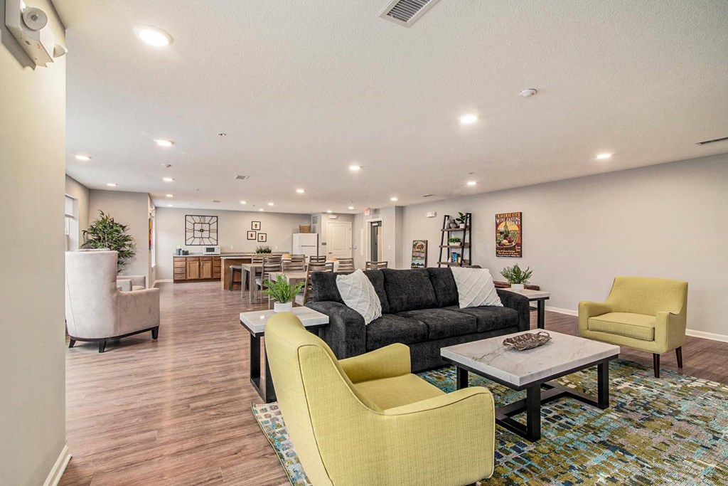 a living room with couches and chairs and a table