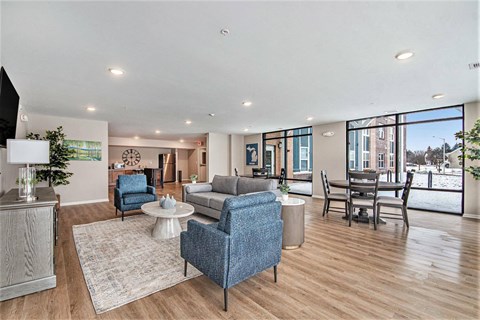A living room with a blue chair in the center.