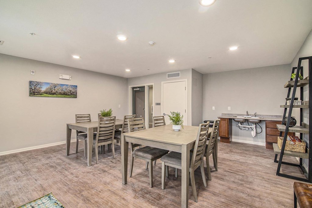 a dining room with a table and chairs
