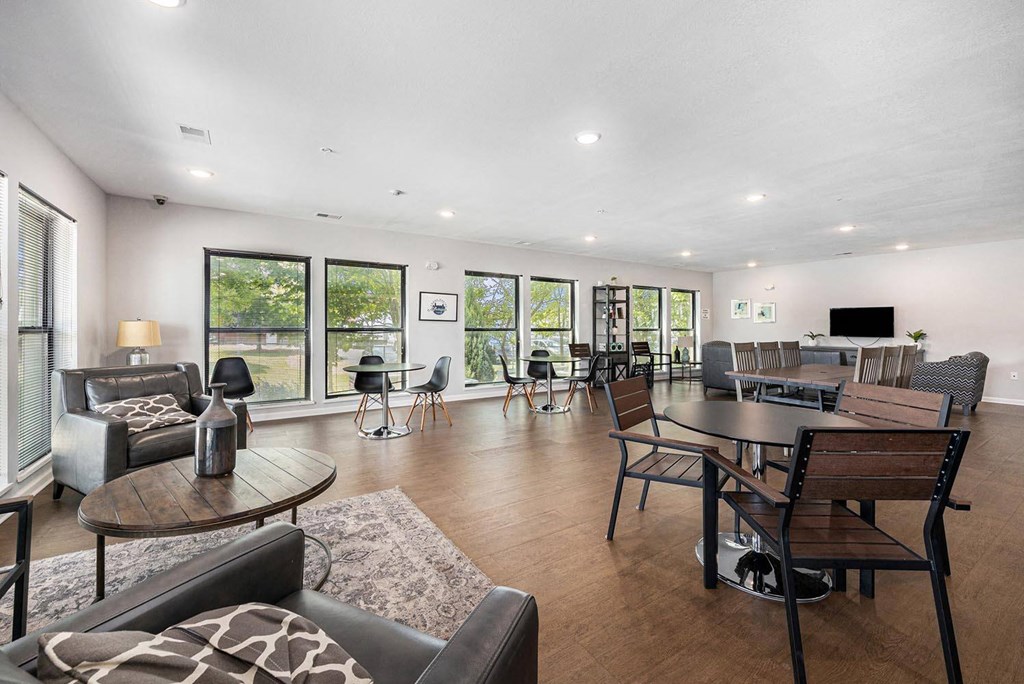 a living room with couches and chairs and a table