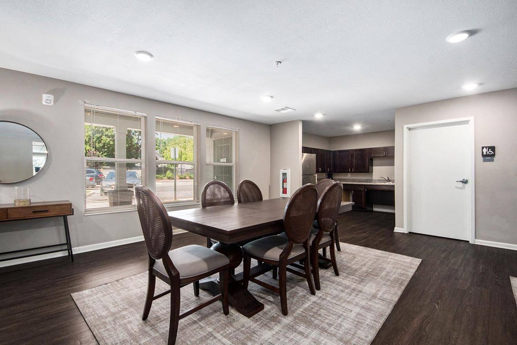 a dining room with a table and chairs