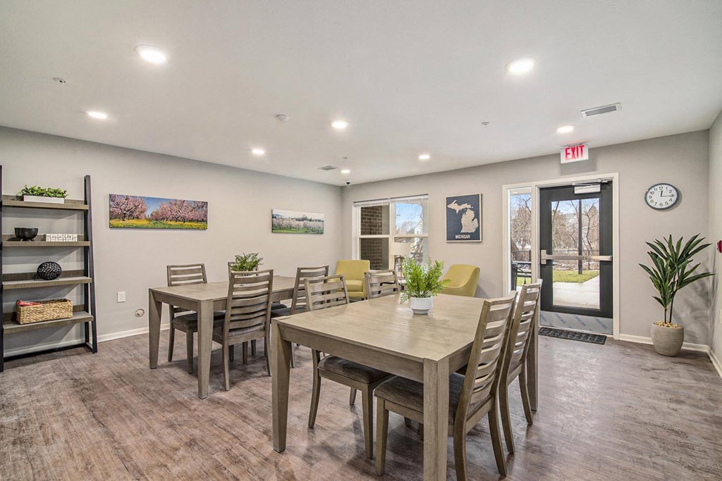 a dining room with a table and chairs