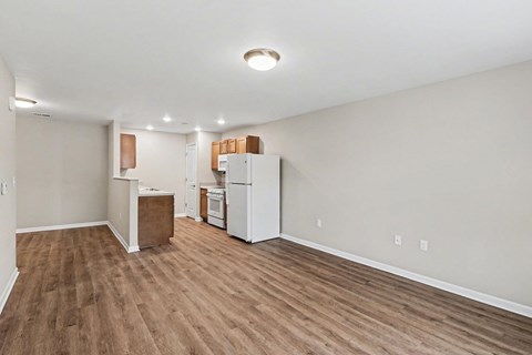 A kitchen area with a white refrigerator and a white oven.